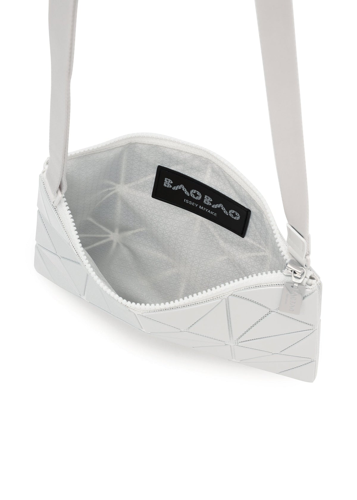 The LUCENT METALLIC by BAO BAO ISSEY MIYAKE is a white geometric crossbody bag with a zippered top, metallic finish, gray patterned lining, and an interior logo label. view 8 of 10