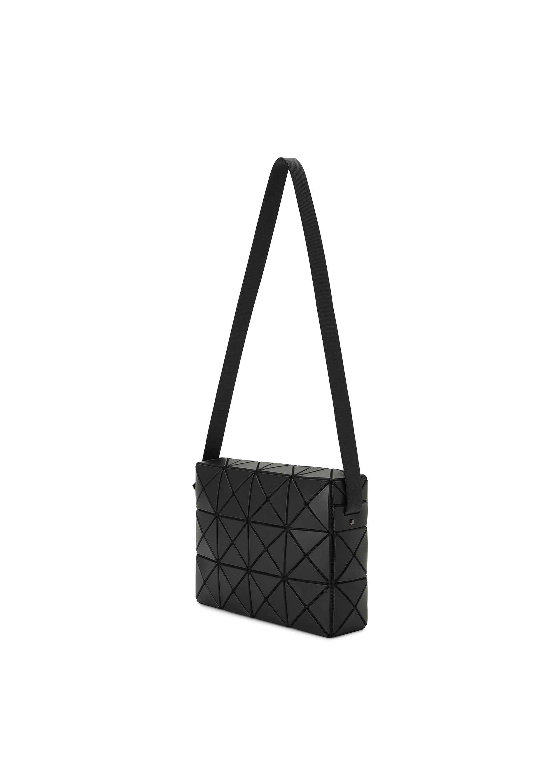 Zoomed view The CUBOID by BAO BAO ISSEY MIYAKE is a rectangular black minimalist bag with a geometric triangular pattern and wide adjustable strap, shown against a white background.