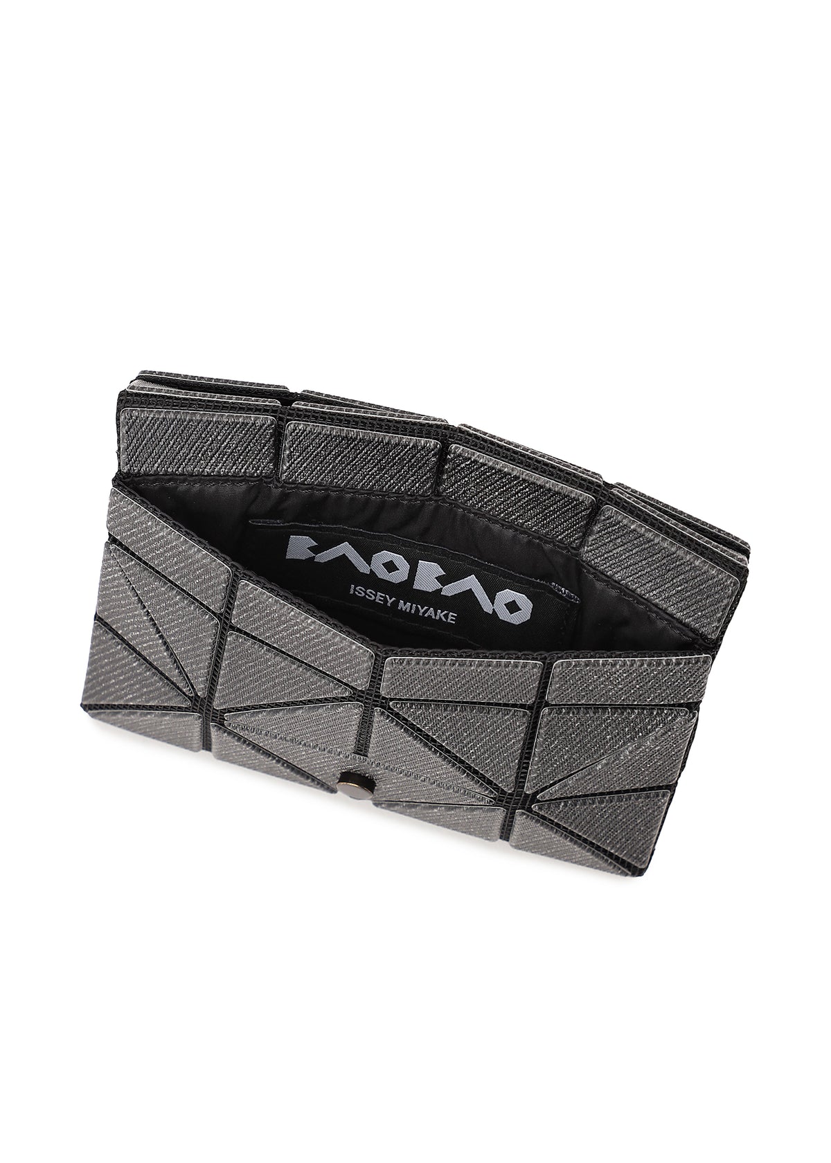 The CARD WALLET by BAO BAO ISSEY MIYAKE features a geometric, silver-gray design with a triangular pattern, partially open to show its black interior and the brand logo—ideal as a mini wallet for a cash-less lifestyle. view 4 of 5