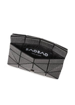The CARD WALLET by BAO BAO ISSEY MIYAKE features a geometric, silver-gray design with a triangular pattern, partially open to show its black interior and the brand logo—ideal as a mini wallet for a cash-less lifestyle.