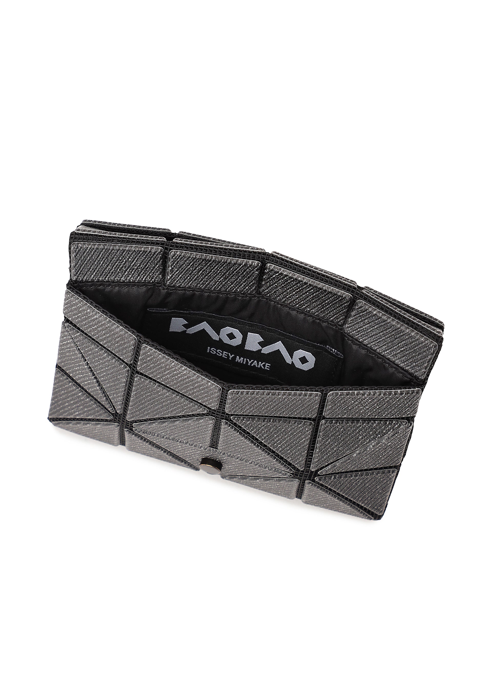 Zoomed view The CARD WALLET by BAO BAO ISSEY MIYAKE features a geometric, silver-gray design with a triangular pattern, partially open to show its black interior and the brand logo—ideal as a mini wallet for a cash-less lifestyle.