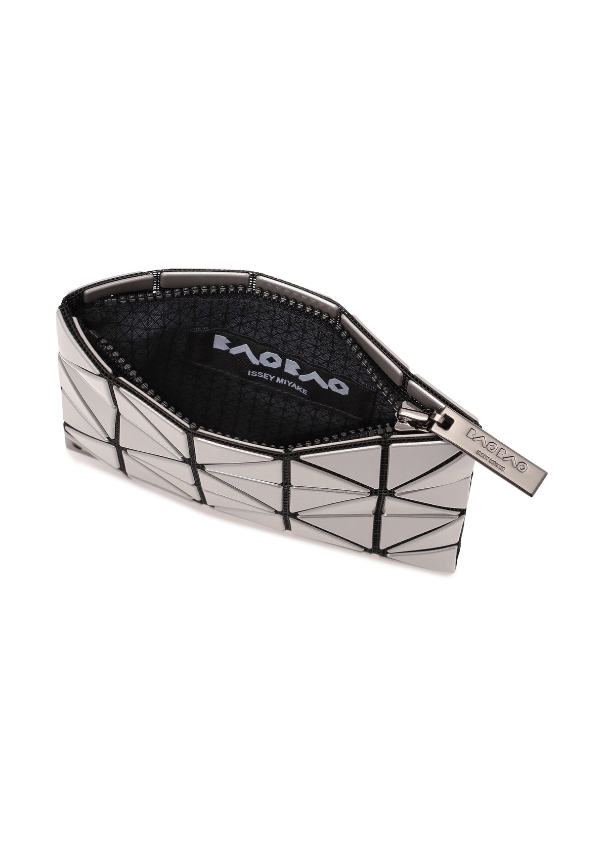 The FLIPPER by BAO BAO ISSEY MIYAKE is a geometric silver and black zippered pouch with a triangular pattern, mesh-lined interior, visible brand label, and ideal as a stylish commuter pass case. view 6 of 7