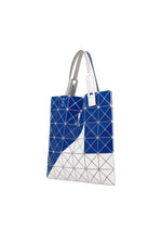 The SIGN tote by BAO BAO ISSEY MIYAKE showcases blue and silver geometric panels with a metallic sheen, white handles, and an angular design—ideal for stylishly carrying A4 documents or a 13-inch laptop.