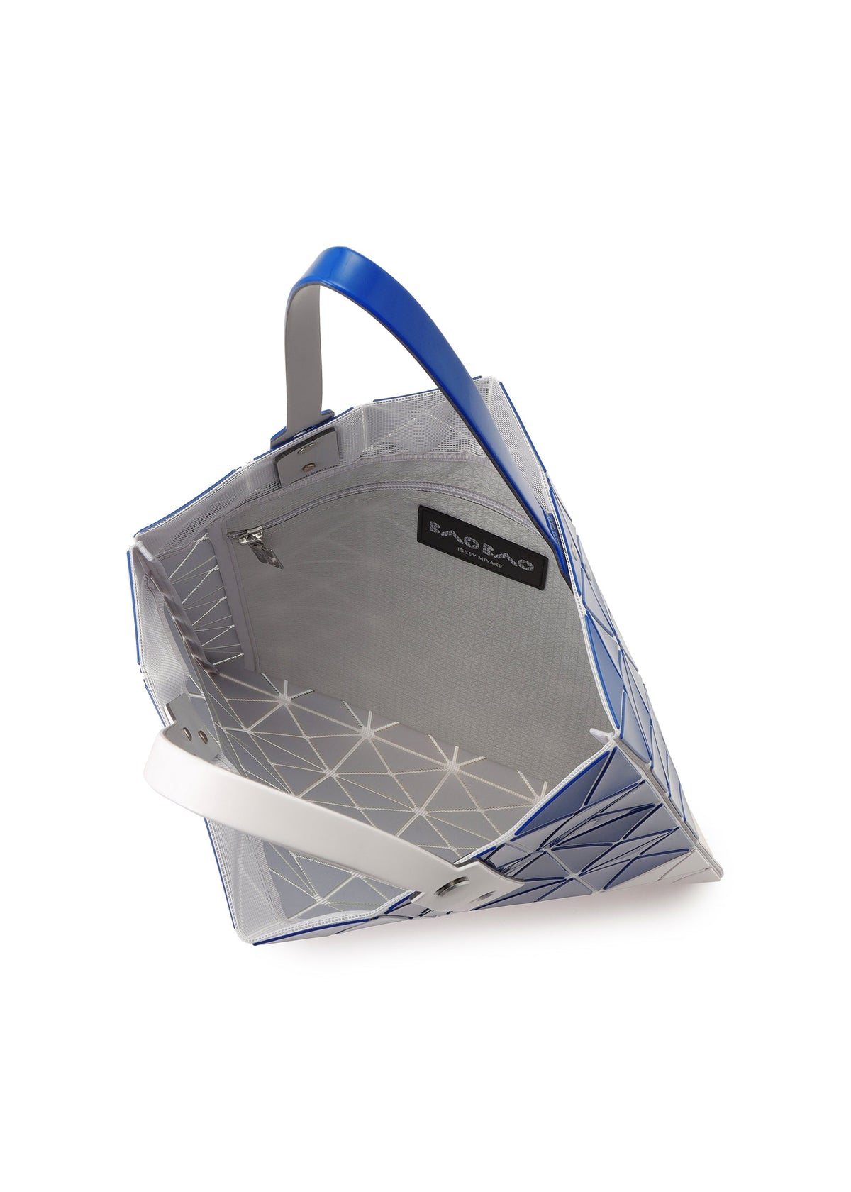 The SIGN tote by BAO BAO ISSEY MIYAKE features a geometric blue and white design, open top, spacious interior for A4 documents or a 13-inch laptop, zippered pocket, black BAO BAO label, and blue and white handles. view 5 of 6