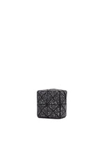 The CITY pouch by BAO BAO ISSEY MIYAKE is a small, black, box-shaped accessory featuring a geometric triangular pattern with white speckles, displayed against a plain white background.