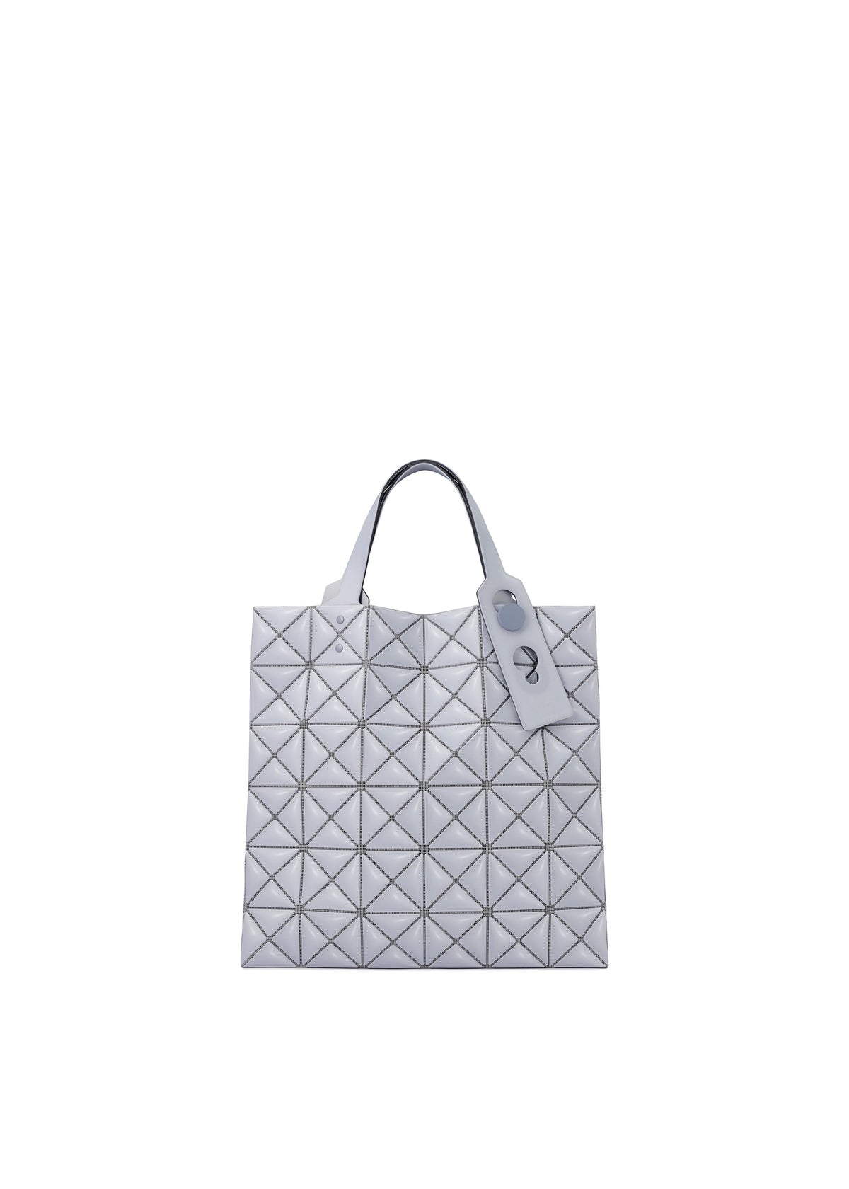 The MINIATURE tote by BAO BAO ISSEY MIYAKE features a silver geometric design with triangular patterns, crafted from matte leather-like material, oversized metal hardware, two handles, and a matching tag against a white background. view 1 of 9