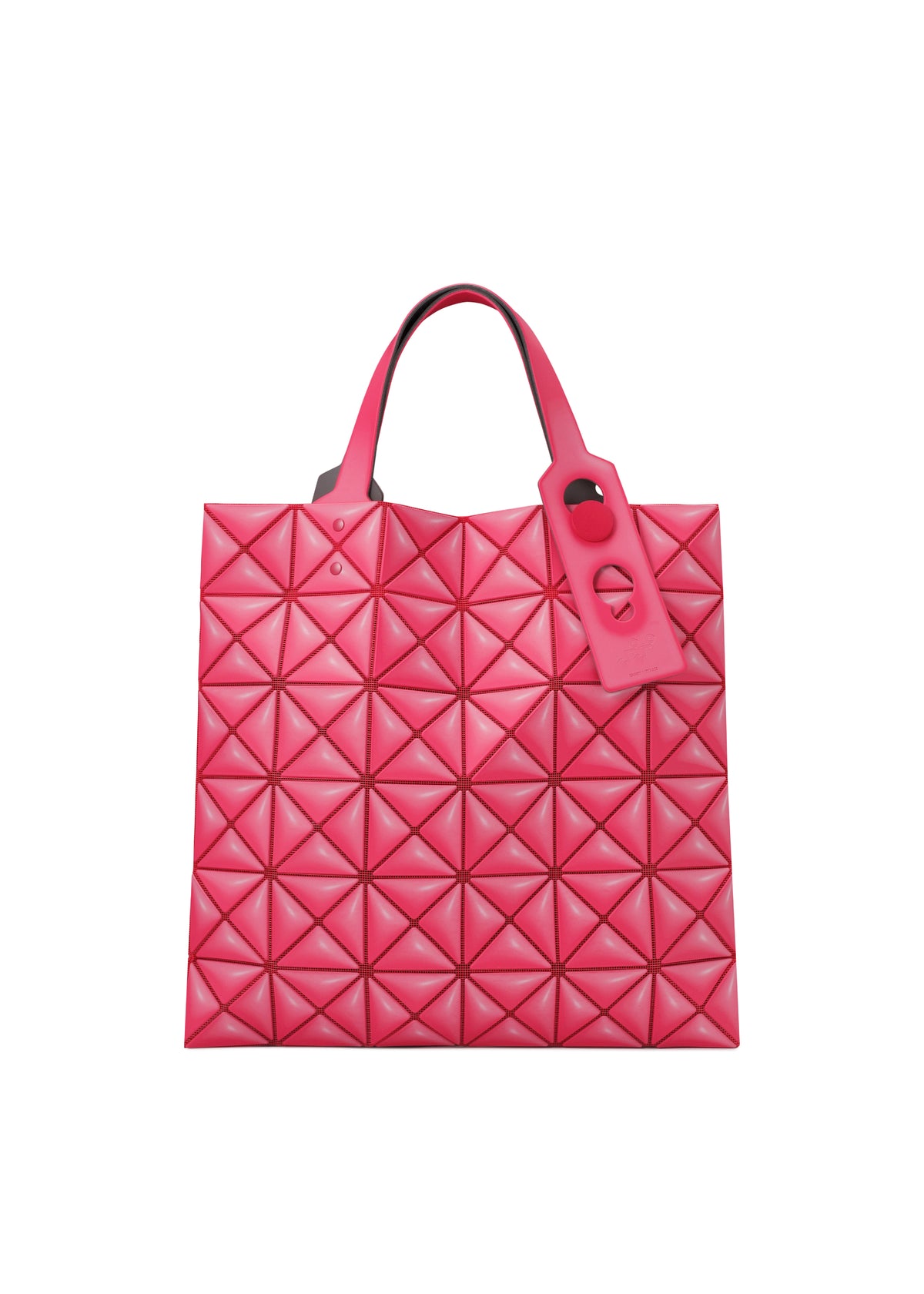 The MINIATURE bag by BAO BAO ISSEY MIYAKE is a bright pink tote with a geometric quilted pattern, two short handles, leather-like material, oversized metal hardware, and a matching pink tag on one handle. view 2 of 9