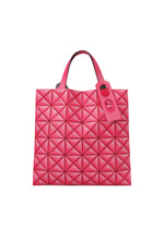 The MINIATURE bag by BAO BAO ISSEY MIYAKE is a bright pink tote with a geometric quilted pattern, two short handles, leather-like material, oversized metal hardware, and a matching pink tag on one handle.