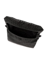 Open black “FROGGY” shoulder bag by BAO BAO ISSEY MIYAKE, featuring a geometric pattern, button closure, adjustable straps, and an interior pocket with the brand label inside.