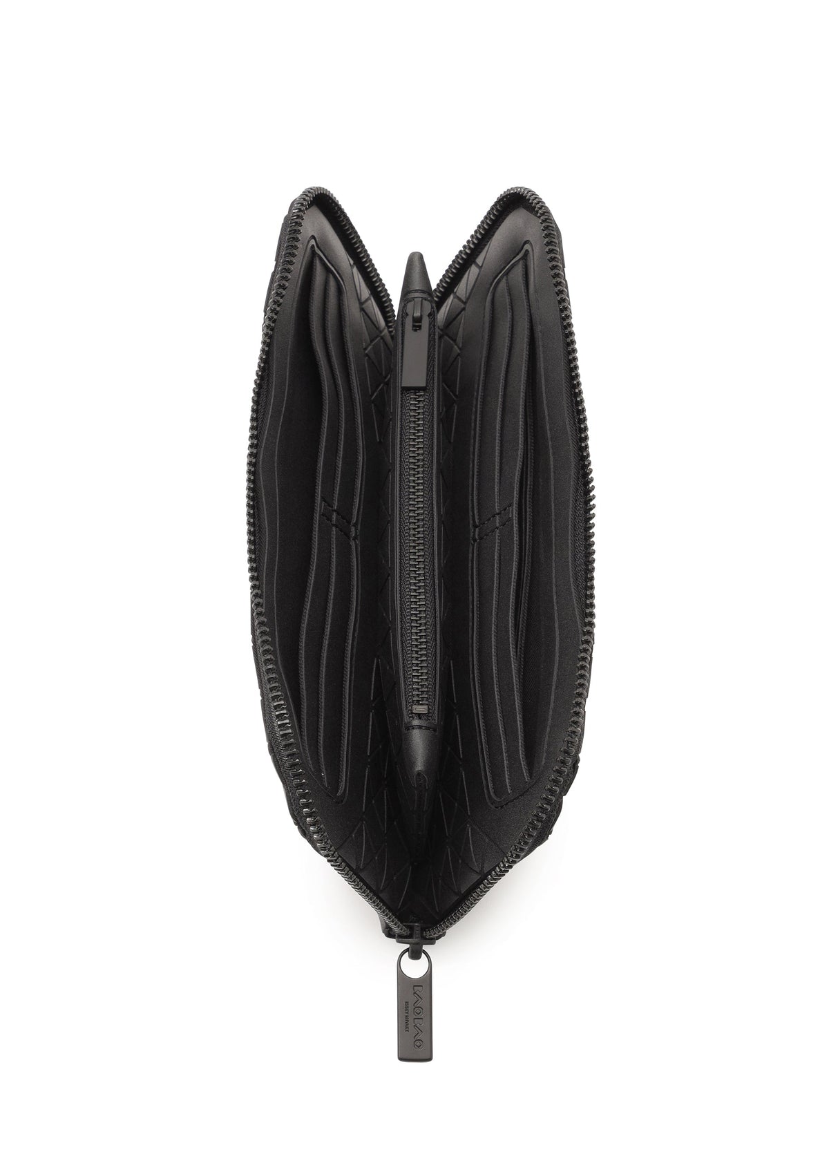 The BOUND wallet by BAO BAO ISSEY MIYAKE, shown from above in black, is open to reveal multiple card slots on both sides, a central zippered coin compartment, and a convenient passport pocket inside. view 3 of 4