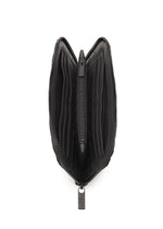 The BOUND wallet by BAO BAO ISSEY MIYAKE, shown from above in black, is open to reveal multiple card slots on both sides, a central zippered coin compartment, and a convenient passport pocket inside.