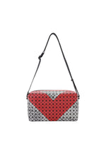 The SADDLE BAG AUTOBAHN by BAO BAO ISSEY MIYAKE features a boxy design with a black strap, black triangle pattern, and bold red heart on structured, unlined dense fabric for a modern look. - RED x LT.GRAY (no.28)