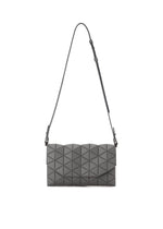The TONNEAU MATTE by BAO BAO ISSEY MIYAKE is a grey, barrel-shaped shoulder bag with a geometric triangle panel design and a long, slim adjustable strap, shown against a plain white background. - DARK GRAY （no.13）