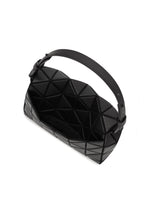 The FOSSETTE cross-body bag by BAO BAO ISSEY MIYAKE features a black geometric triangular design on the exterior, a thick strap, and a magnetic closure. Pictured from above, its open interior is displayed.