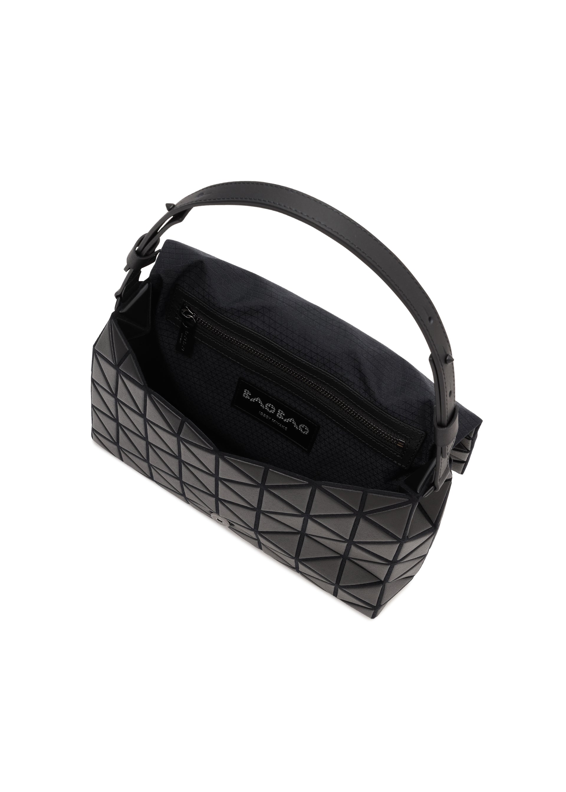 Zoomed view The FOSSETTE handbag by BAO BAO ISSEY MIYAKE is a black geometric-patterned bag with a short handle, an open top secured by a magnetic closure, and features a zippered inner pocket and fabric lining.