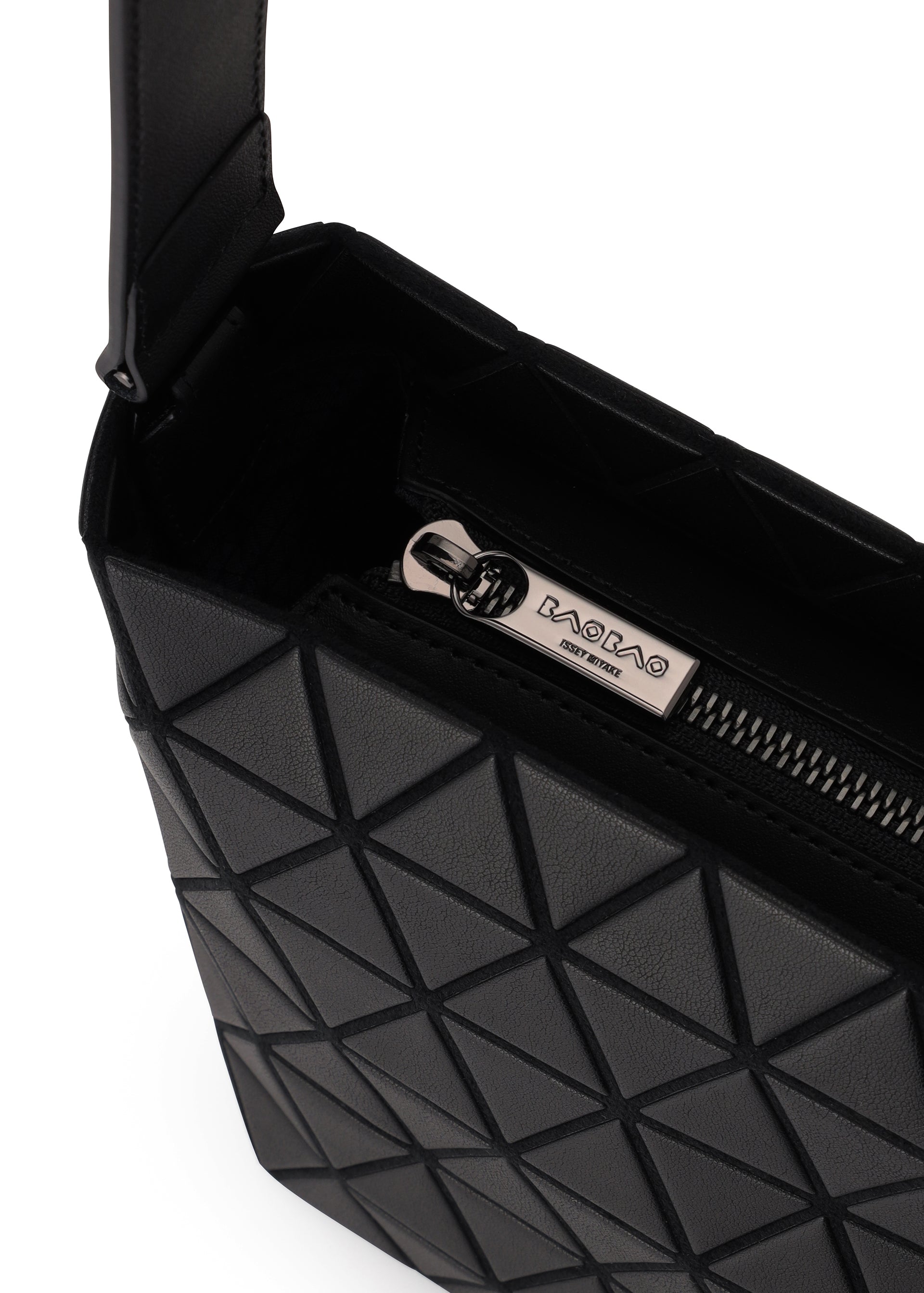 Zoomed view Close-up of the BAO BAO ISSEY MIYAKE CRYSTAL MATTE shoulder bag in black with a geometric pattern, leather straps, and a partially open zipper showing a metal pull engraved with BACBAC. The bag boasts a modern, structured matte design.