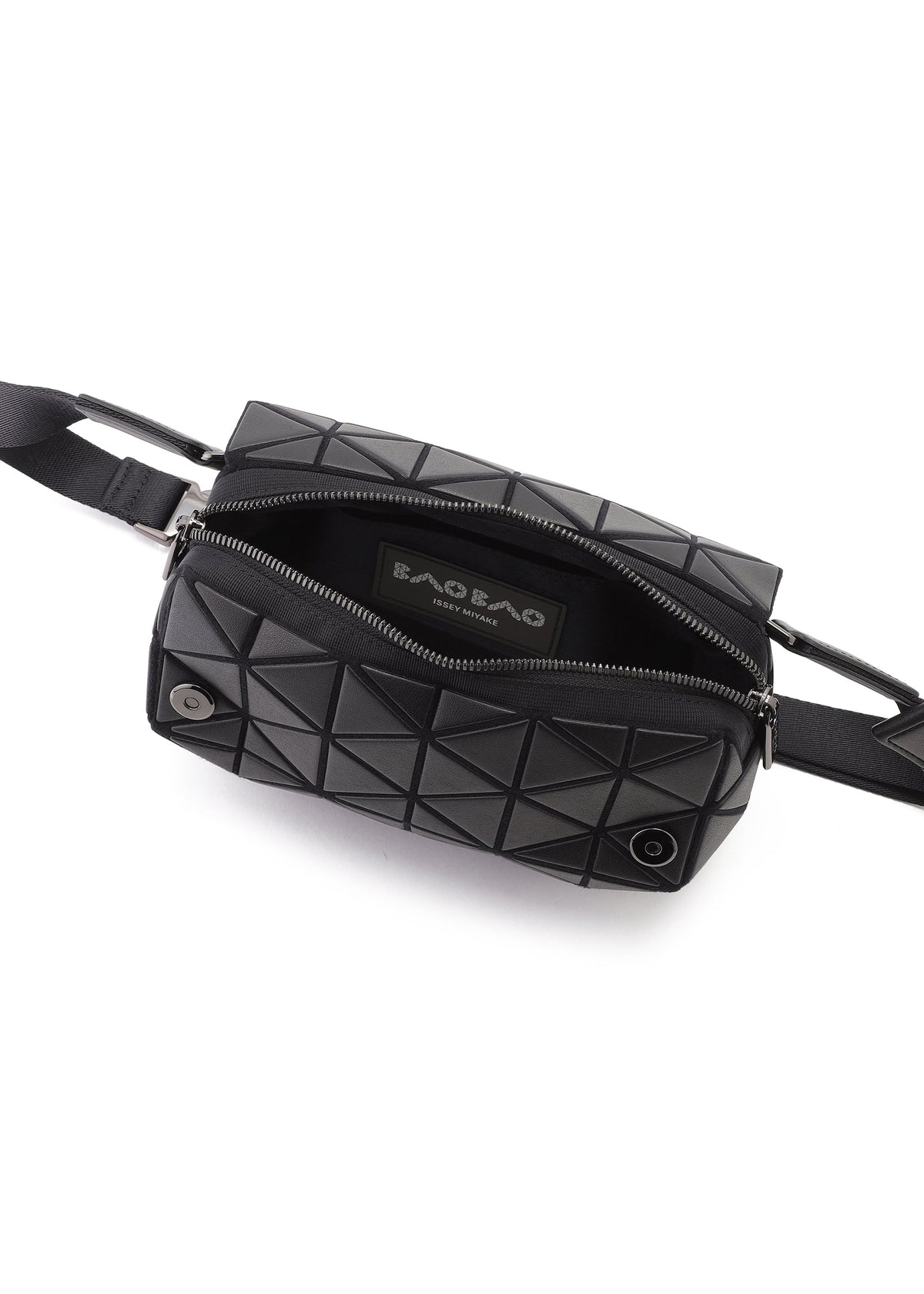 Zoomed view The HEXAGON sling bag by BAO BAO ISSEY MIYAKE features a black geometric design, leather-like textured surface with triangles, an adjustable black strap, and a partially open zipper revealing the inner label.