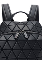 Close-up of the BAO BAO ISSEY MIYAKE HEXAGON backpack in black, featuring geometric triangular panels, two branded zipper pulls, and a front zip pocket on its sleek surface.
