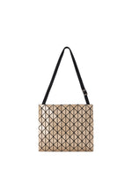 A beige geometric tote bag from the ROW METALLIC series by BAO BAO ISSEY MIYAKE, crafted with a polarized pearl material and featuring a black grid pattern and a single adjustable black shoulder strap, photographed on a white background. - BEIGE （no.41）
