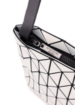 A close-up of a white geometric-patterned BAO BAO ISSEY MIYAKE ROW METALLIC shoulder bag, showcasing its signature triangular tiles crafted from metallic material and highlighted by sleek black lines, zipper, and strap against a white background.