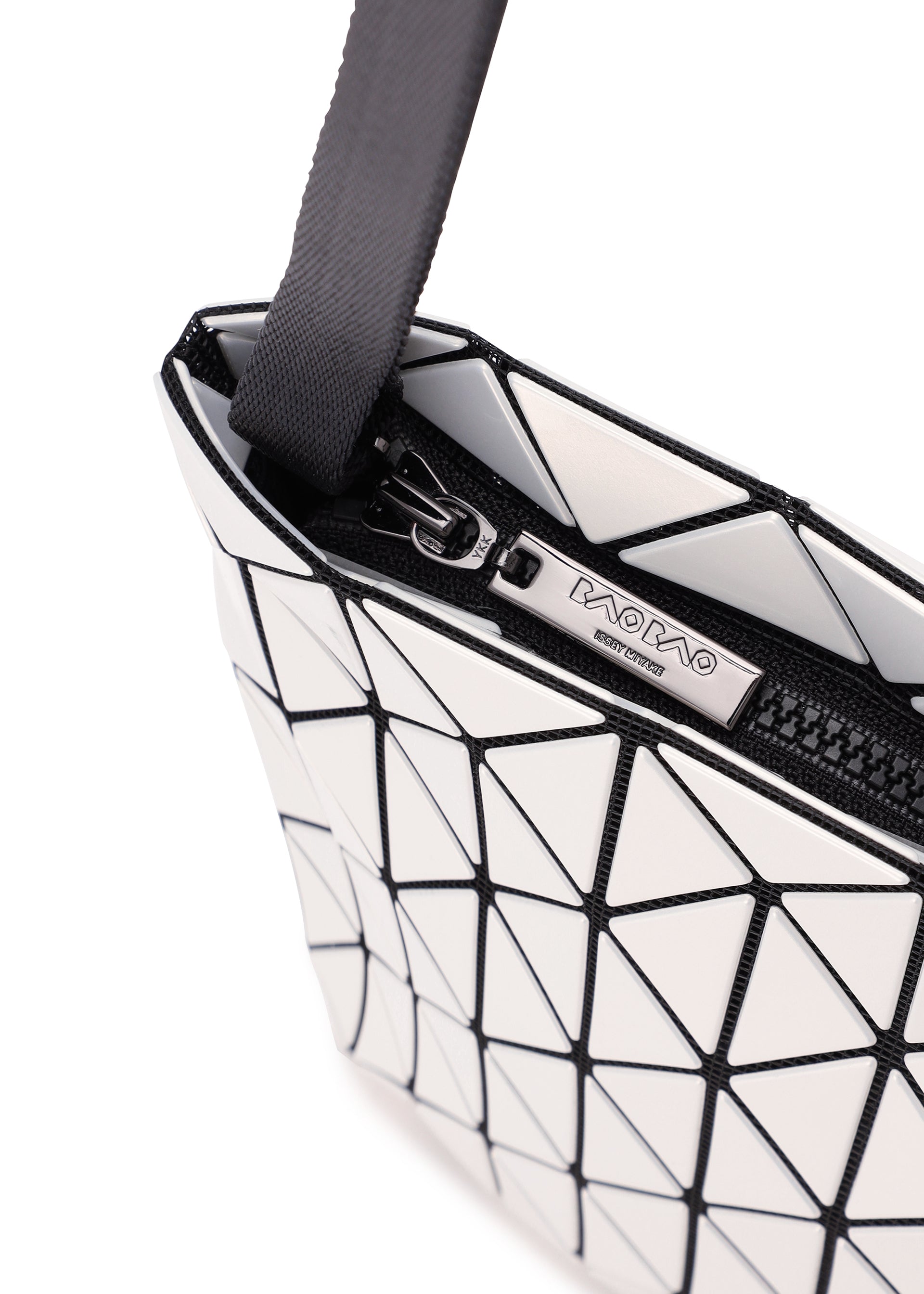 Zoomed view A close-up of a white geometric-patterned BAO BAO ISSEY MIYAKE ROW METALLIC shoulder bag, showcasing its signature triangular tiles crafted from metallic material and highlighted by sleek black lines, zipper, and strap against a white background.