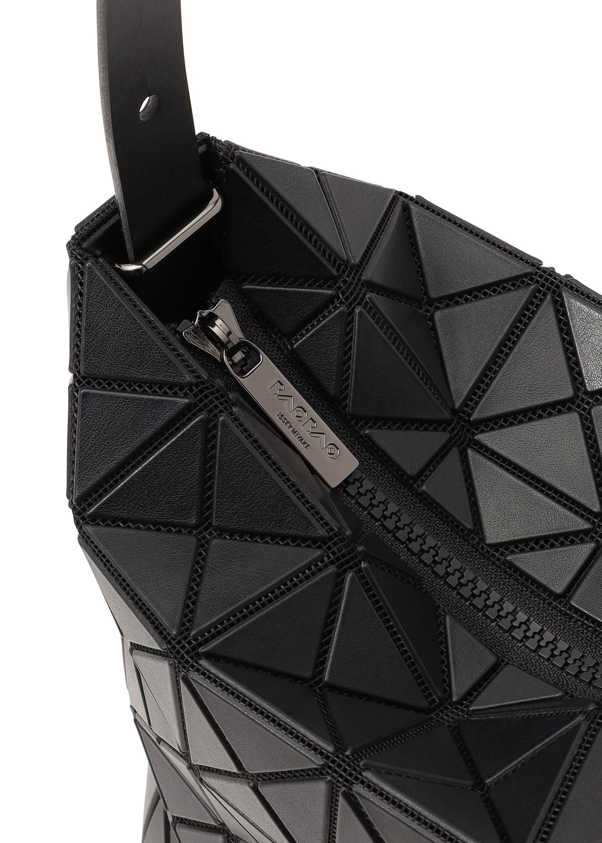 Close-up of the black VALLEY handbag by BAO BAO ISSEY MIYAKE, featuring a geometric pattern, gusseted design, visible zipper with an engraved pull, and a strap. The structure lets the bag stand upright. view 3 of 6