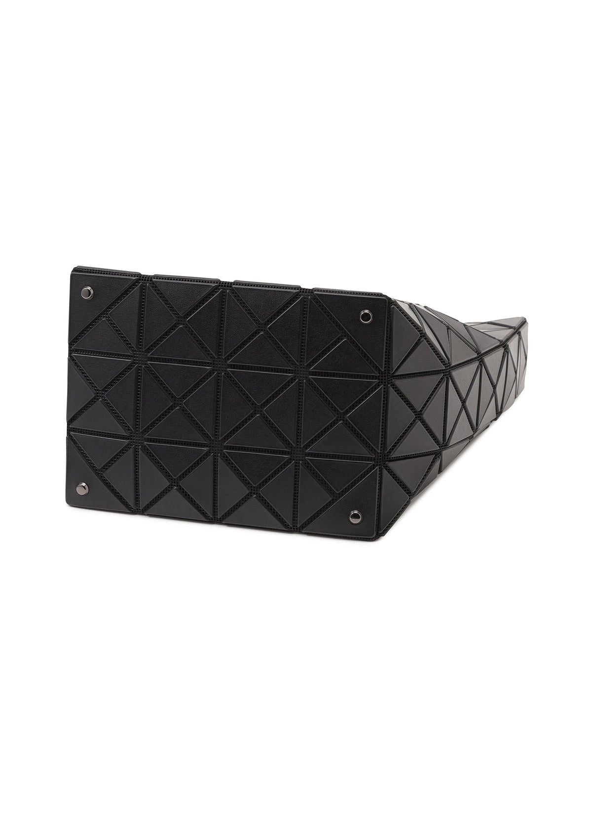 Zoomed view The VALLEY handbag by BAO BAO ISSEY MIYAKE is shown from the bottom, with black geometric triangular panels forming a grid and four metal studs at the corners.