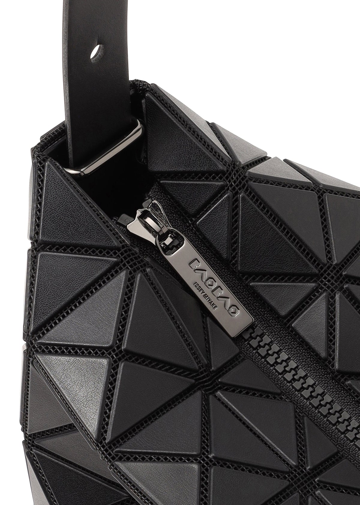 Close-up of a black geometric-patterned gusseted handbag with a metallic zipper partially open, showing the engraved brand name BAO BAO ISSEY MIYAKE on the VALLEY zipper pull. view 4 of 7