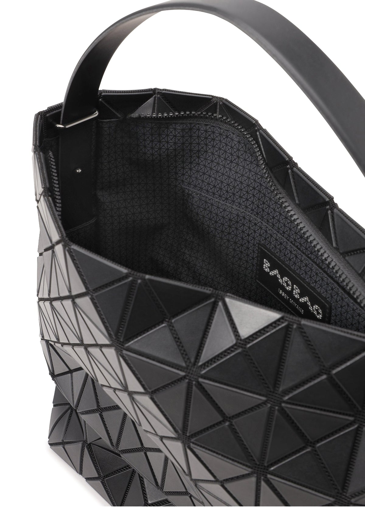 A close-up of a black VALLEY tote by BAO BAO ISSEY MIYAKE, featuring geometric triangular patterns, open top, adjustable handle strap, textured lining, and a visible branded interior label. view 5 of 7