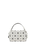 The BOSTON by BAO BAO ISSEY MIYAKE is a white geometric mini bag with black grid triangles on matte, leather-like material. Featuring two white straps with silver rivets, this stylish casual party bag is shown on a plain white background. - OFF WHITE （no.03）