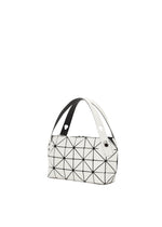 The BOSTON by BAO BAO ISSEY MIYAKE is a white mini bag with black geometric triangle lines, crafted from matte leather-like material. It boasts a wide black and white handle and a modern, structured shape—ideal for casual parties.