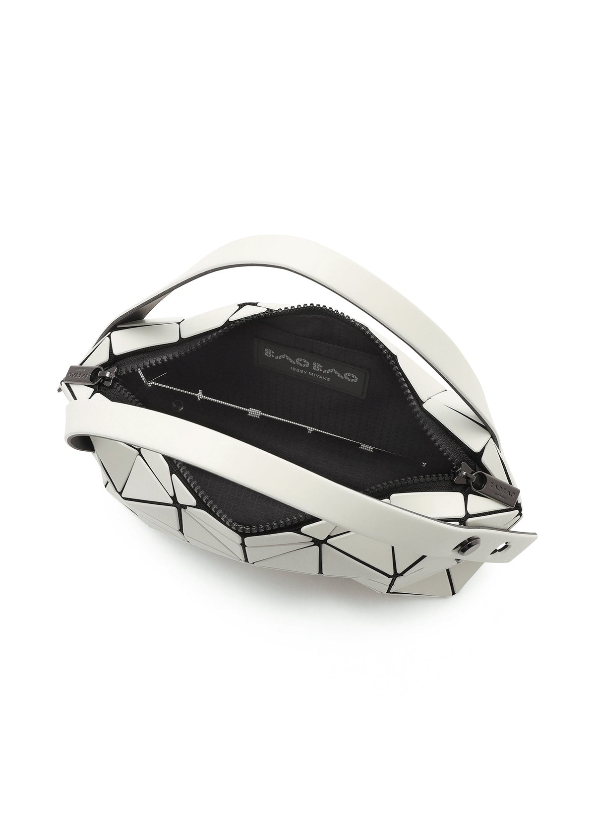 The BOSTON by BAO BAO ISSEY MIYAKE is a mini bag with a geometric black and white triangular pattern, crafted from matte leather-like material. It has a zippered opening, black interior, and features the brand label inside. view 5 of 6