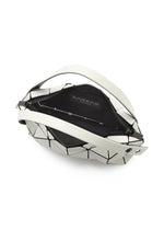 The BOSTON by BAO BAO ISSEY MIYAKE is a mini bag with a geometric black and white triangular pattern, crafted from matte leather-like material. It has a zippered opening, black interior, and features the brand label inside.