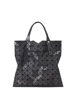 A black geometric PRISM GLOSS tote bag by BAO BAO ISSEY MIYAKE, featuring striking triangular patterns, a glossy enamel-like finish, two handles, and a tag attached to one handle—perfect as an A4 laptop bag for stylish everyday use. - CHARCOAL GRAY （no.14）