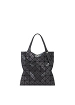 The PRISM GLOSS tote bag from BAO BAO ISSEY MIYAKE features black, triangular reflective panels made from an enamel-like material and two black handles, all showcased against a plain white background. - CHARCOAL GRAY （no.14）
