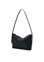 The MUSETTE by BAO BAO ISSEY MIYAKE is a black cross-body bag featuring a modern, angular geometric pattern with a textured, triangular tile design. Crafted from leather-like material, it has a slightly slouched silhouette and comes with a long adjustable strap—combining contemporary style with practical storage.