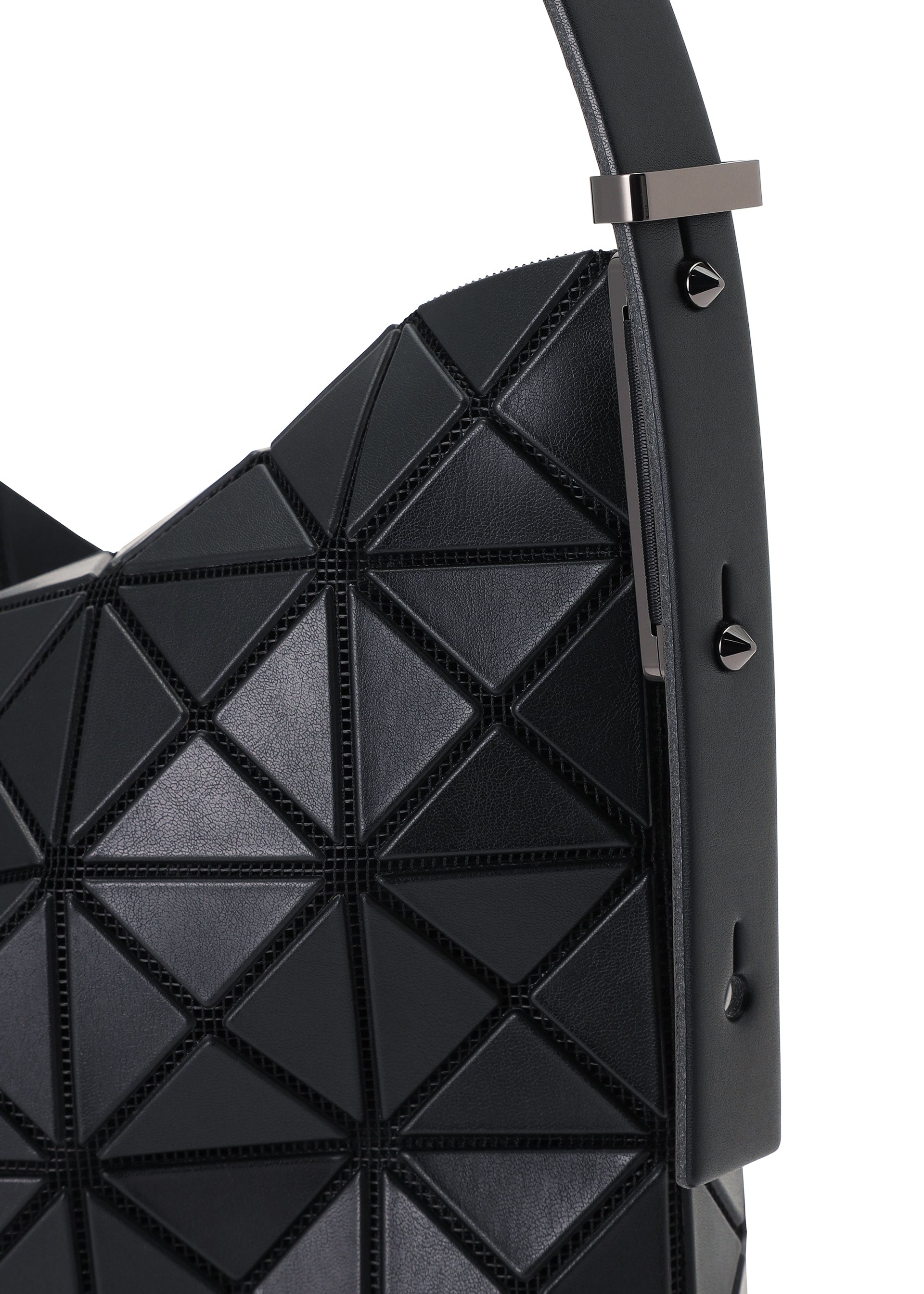 Zoomed view Close-up of the MUSETTE by BAO BAO ISSEY MIYAKE—a black geometric cross-body handbag crafted from a leather-like material with signature triangular patterns and a wide strap adorned with metallic studs. This stylish bag combines modern design with practical storage for your essentials.