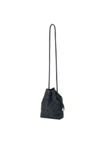 The WRING CLAY by BAO BAO ISSEY MIYAKE is a black crossbody bag featuring a geometric pattern, a long strap, and a bow detail on the side. Crafted from nubuck-like material, it is displayed against a white background.