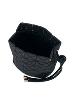 Introducing the WRING CLAY by BAO BAO ISSEY MIYAKE—a black bucket bag featuring a geometric pattern, gold-tone accents, and a drawstring closure. Crafted from nubuck-like material and shown open from above to highlight its spacious interior, this stylish design seamlessly transitions from a drawstring bag to a modern shoulder bag.