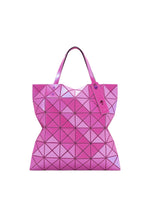 The LUCENT ONE-TONE by BAO BAO ISSEY MIYAKE is a pink enamel tote bag with geometric triangular patterns, dual handles, and a matching pink tag on one handle. - HORIZON PINK （no.26）