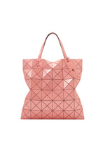 The BAO BAO ISSEY MIYAKE LUCENT ONE-TONE tote bag, featuring pink triangular geometric patterns, two handles, and a glossy enamel finish, is displayed against a white background. - SUNSET CORAL （no.31）