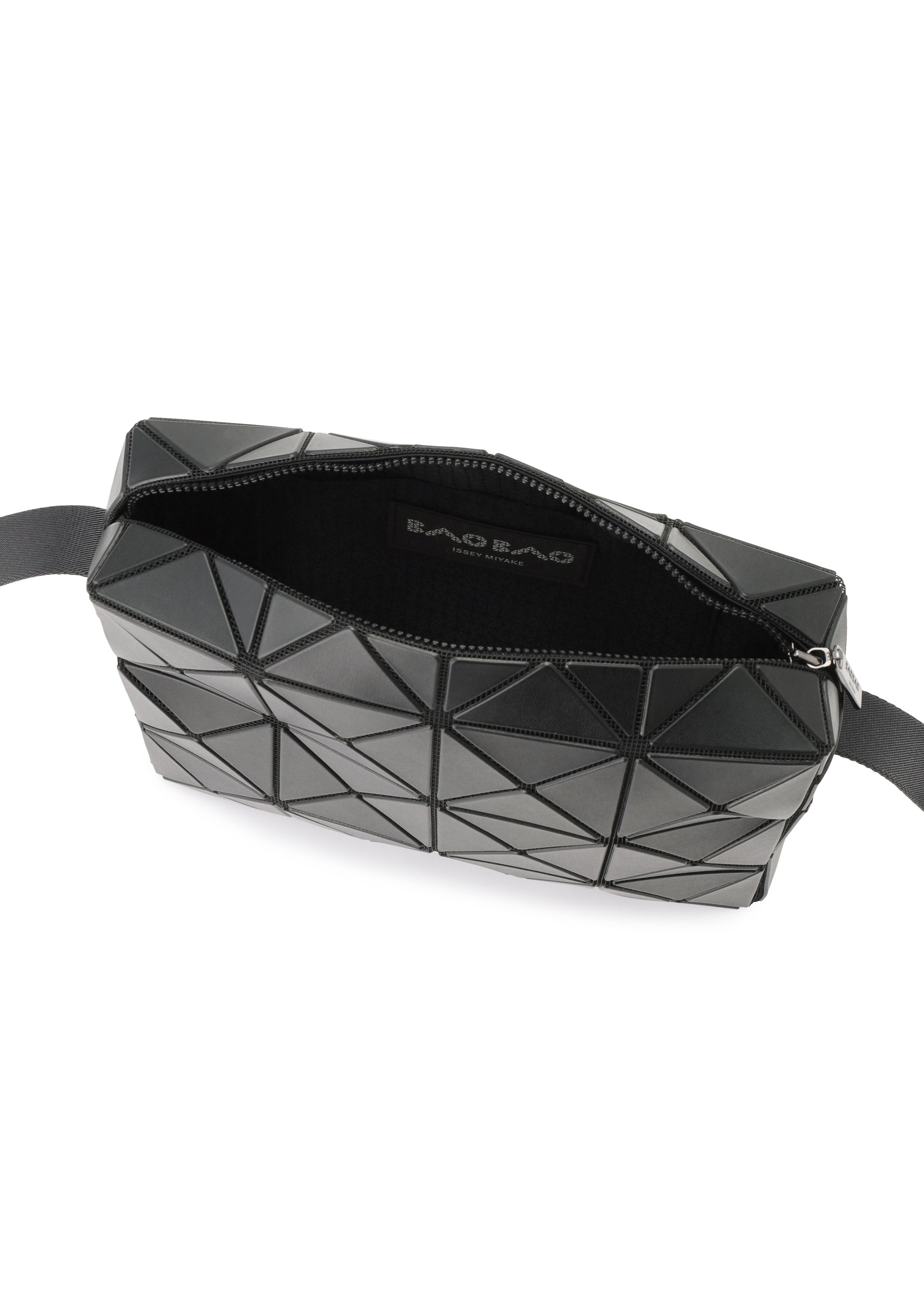 Zoomed view A black crossbody bag from BAO BAO ISSEY MIYAKE, the CUBOID features a geometric pattern with triangular panels and a cuboid silhouette that emphasizes its minimalist design. It is partially unzipped to reveal a black interior and a fabric label inside, with a black strap attached at both ends.