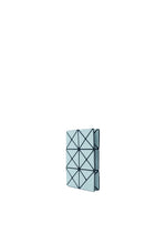 A small, light blue TWINKLE wallet by BAO BAO ISSEY MIYAKE features black grid lines and triangular patterns, ideal as a card holder or coin case, shown standing upright on a plain white background.