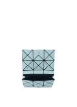The TWINKLE card holder wallet by BAO BAO ISSEY MIYAKE is small, light blue with a geometric pattern and snap closure, shown open to reveal its black interior.