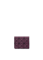 The TWINKLE clutch by BAO BAO ISSEY MIYAKE is a rectangular, plum-colored purse with a geometric triangular pattern that doubles as a compact card holder, shown on a white background. - BURGUNDY （no.85）