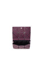 The TWINKLE by BAO BAO ISSEY MIYAKE is a purple geometric-patterned clutch with a black interior, triangular exterior shapes, and a silver snap button. It also functions as a compact card holder.