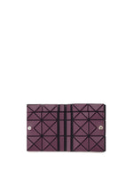 The TWINKLE by BAO BAO ISSEY MIYAKE is a rectangular purple bifold wallet featuring a geometric triangular pattern with black dividing lines and two snap buttons on the front.