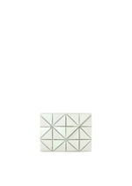 The BAO BAO ISSEY MIYAKE CARD WALLET is a small, rectangular white wallet featuring a geometric pattern with raised triangles and silver stud outlines—ideal for a chic, cashless lifestyle. - GREEN WHITE （no.04）