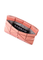 A pink geometric clutch with a silver interior, partly open to reveal a black BAO BAO ISSEY MIYAKE tag—perfect for pairing with the CARD WALLET by BAO BAO ISSEY MIYAKE for a chic, cashless lifestyle.