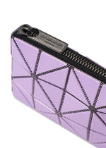 Here is your rewritten sentence using the provided product data: Close-up of a lavender geometric CASSETTE pouch from BAO BAO ISSEY MIYAKE, featuring triangular panels with black seams and a black zipper. The zipper pull is engraved with the brand name. This stylish zipper case combines modern design and function, making it perfect as a card holder or coin pouch.